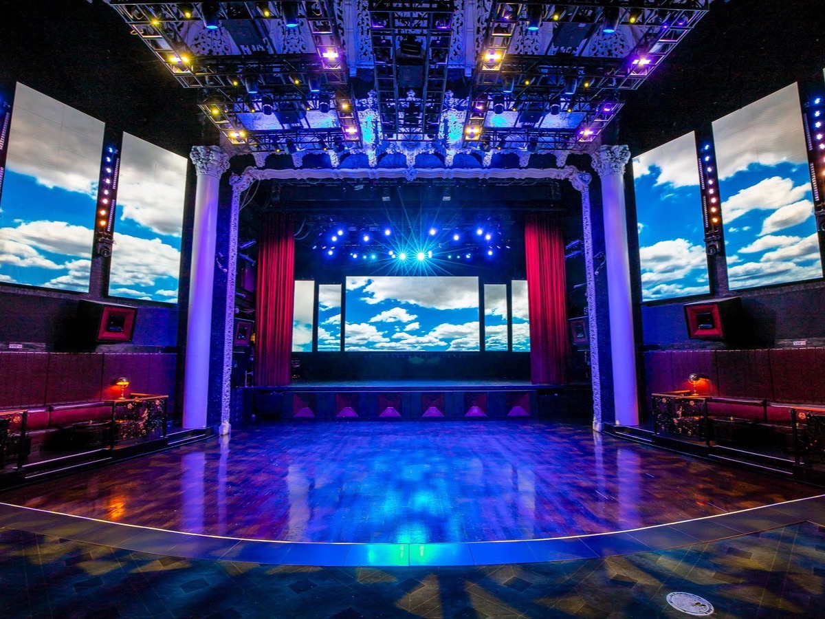 The Avalon main stage lit for a show, red curtains drawn back